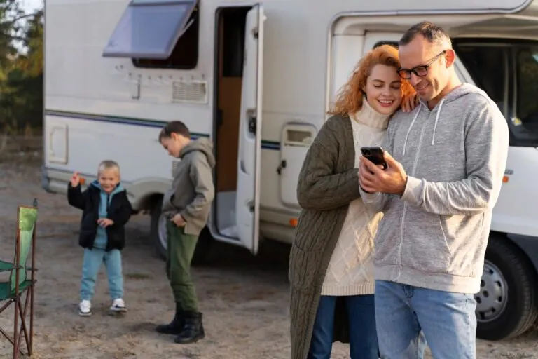 Family reviewing the cost of mobile homes on their phone.